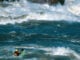 a whitewater kayaker paddling among large rapids on the Slave River