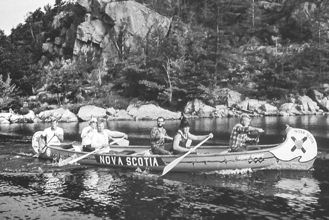 a group of men participate in a canoe expedition marking Canada's centennial in 1967