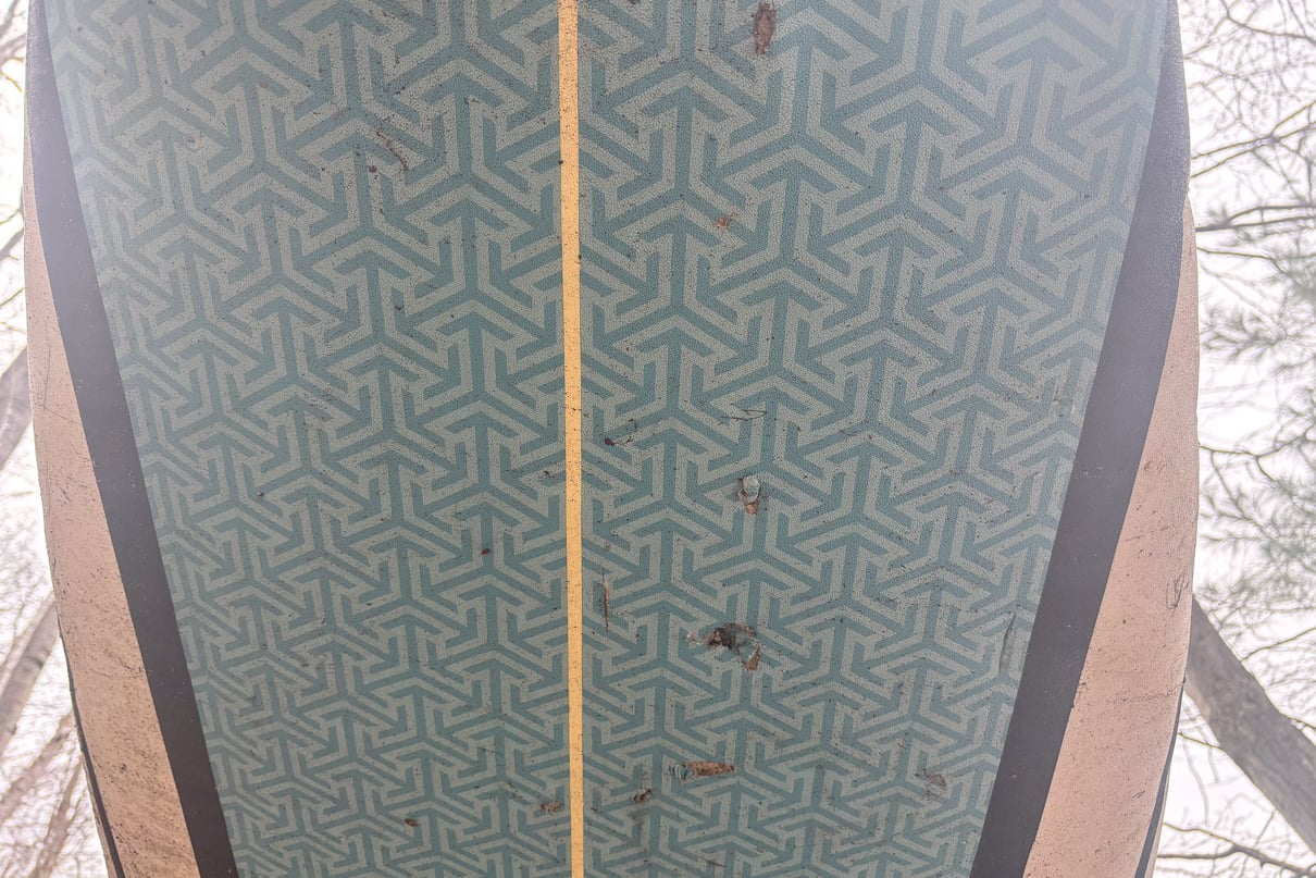 Example of a damaged used paddleboard with holes in it