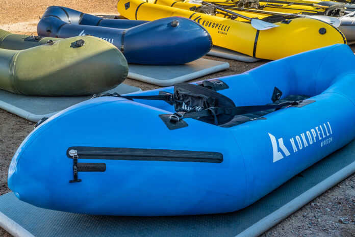 a bunch of Kokopelli packrafts laid out on the ground