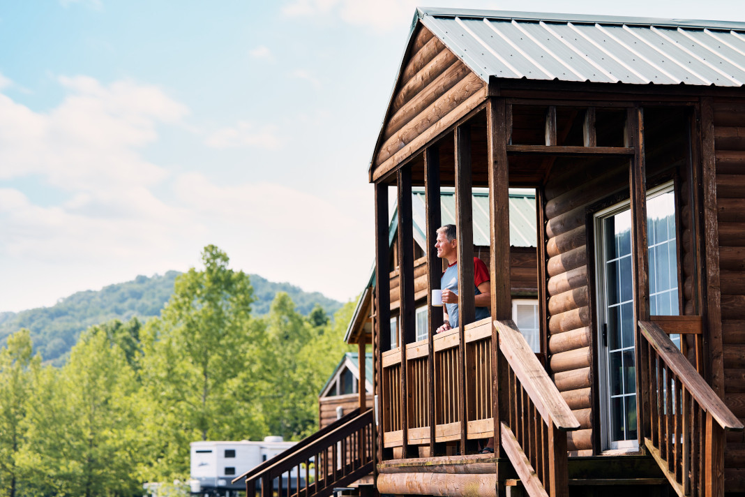 Enjoying a cup of coffee on a cabin porch in Missouri.