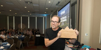 Jeff Moag poses with his award