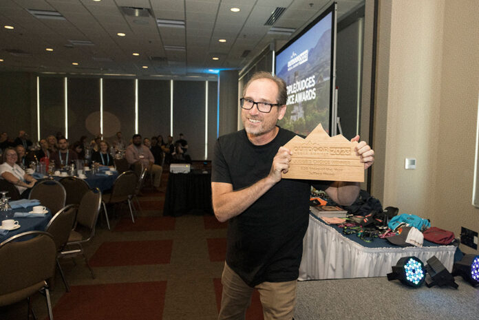Jeff Moag poses with his award