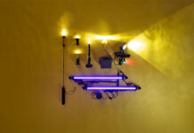 a selection of kayak lights laid out on a yellow backdrop