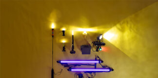 a selection of kayak lights laid out on a yellow backdrop