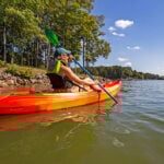 Recreational Kayak Review: Perception Tribe 9.5 woman paddling the Perception Tribe 9.5 recreational kayak