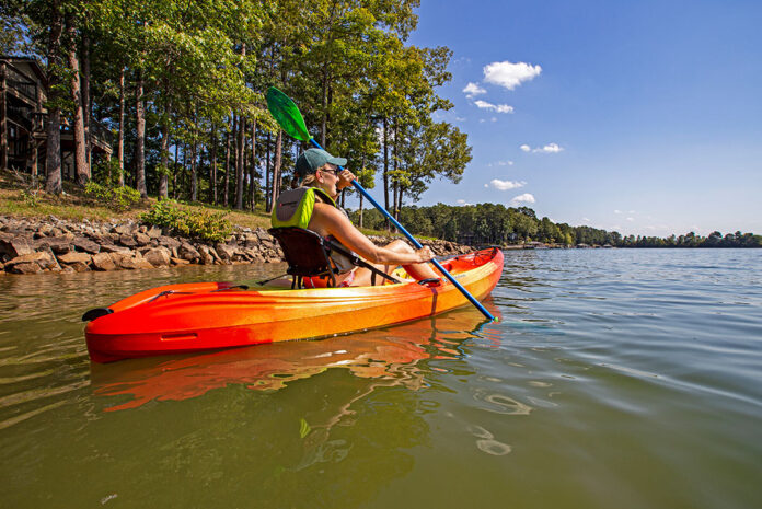 woman paddling the Perception Tribe 9.5 recreational kayak