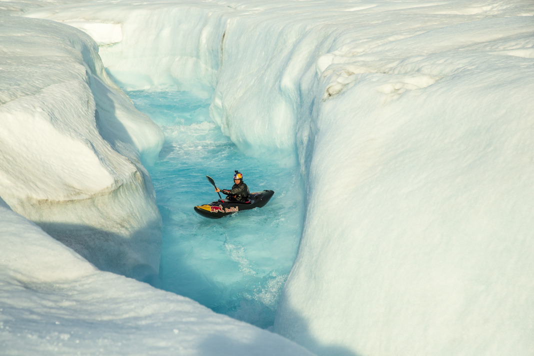 Aniol Serrasolses paddles the river on the Austfonna ice cap, Svalbard.