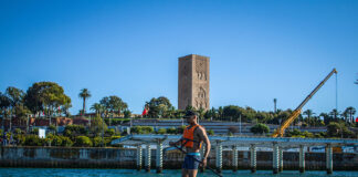 man stands and paddles a beginner paddleboard