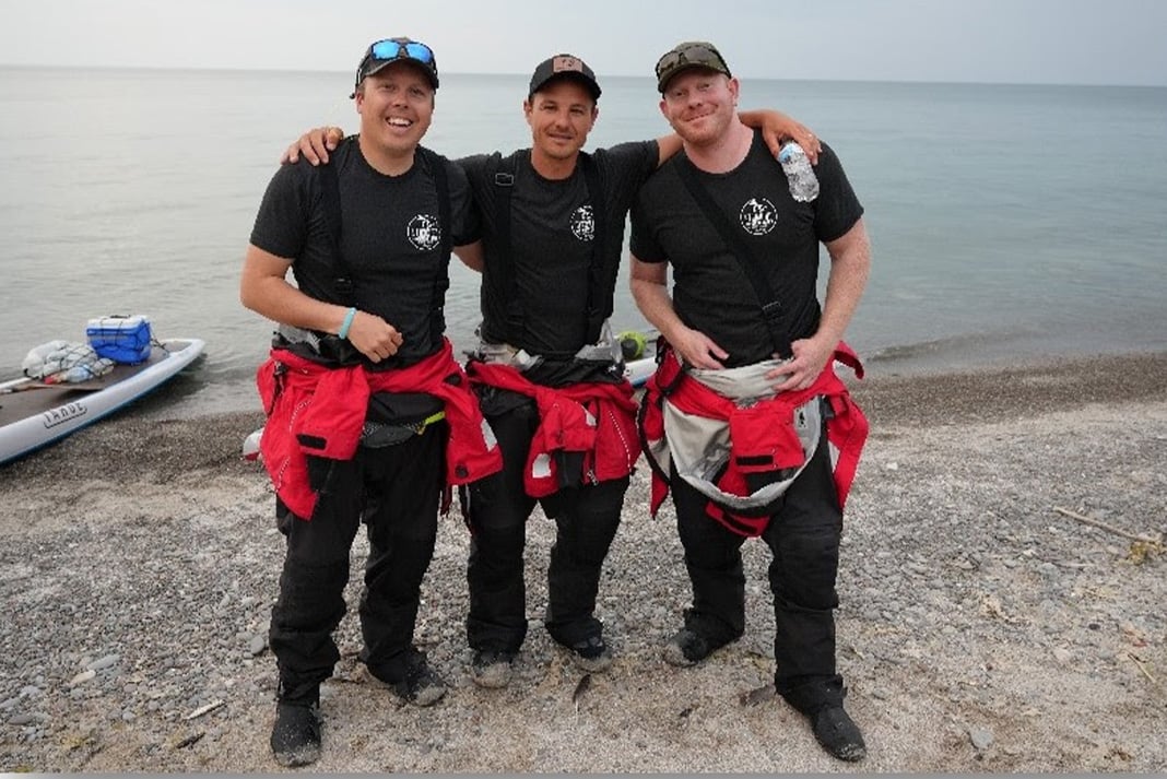 Jeff Guy, Kwin Morris and Joe Lorenz on the shores of Lake Ontario by Fort Niagara after 35 mile 13 hour paddle from Toronto on Friday June 9, 2023