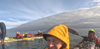 a brief sunny spell as the Arctic Cowboys paddle their kayaks through the Northwest Passage