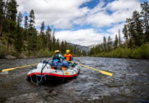 two rafters paddle down the Middle Fork of the Salmon River