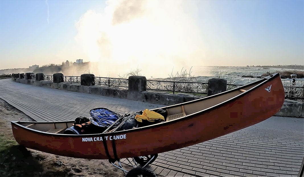 Adam Shoalts' canoe rig in front of Niagara Falls