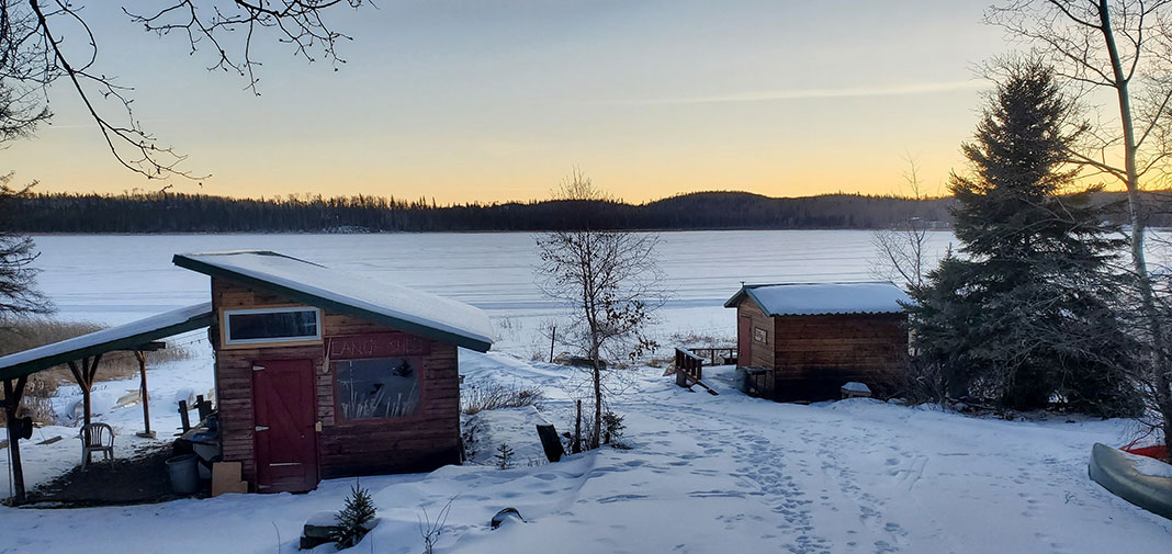 view of lakeside buildings at Churchill River Canoe Outfitters