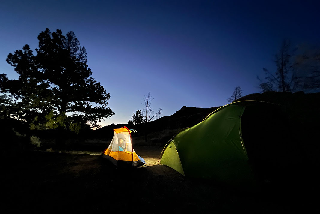 a family camps along the John Day River after receiving permits for a river trip