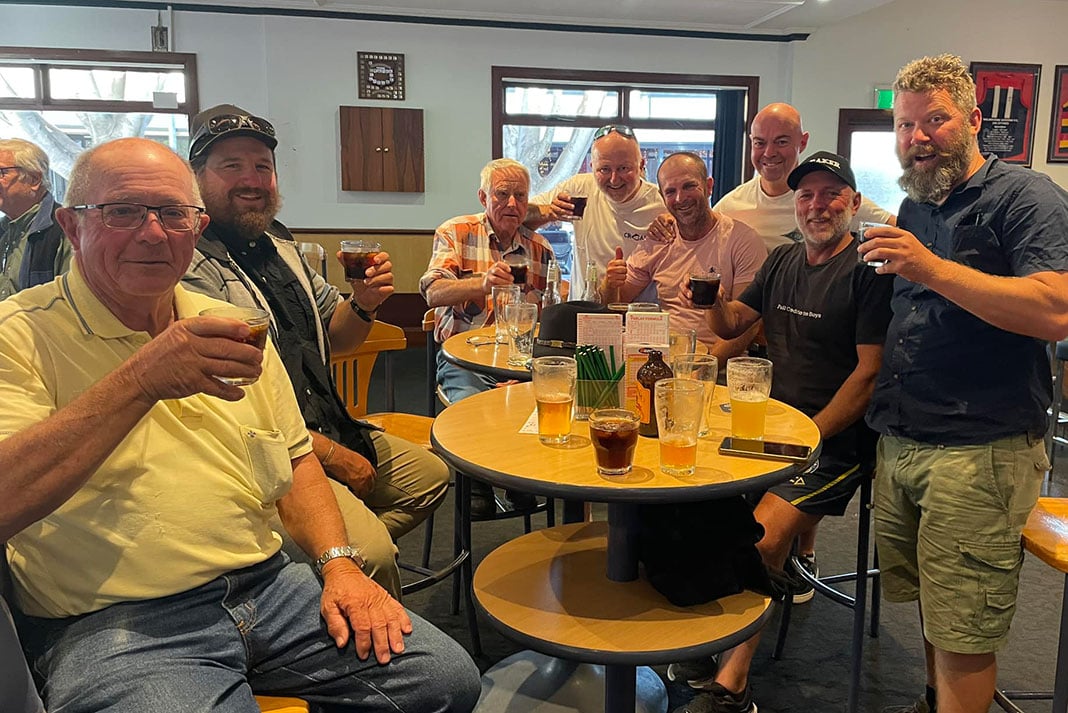 Dave Alley and his crew raise glasses in a toast after the expedition