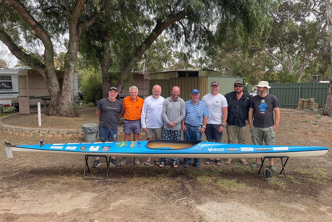 Dave Alley and support team pose with his kayak after the record-setting trip