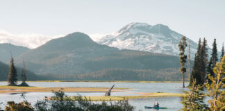 a kayaker paddles on a trip through beautiful Oregon scenery in America