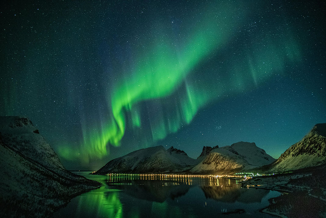 northern lights over a mountainous destination