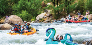 people take part in a rafting race with whimsical inflatables near 4Corners Riversports in Durango, Colorado