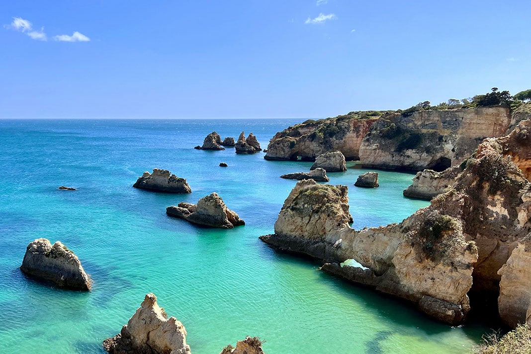 beautiful view of turquoise waters and dramatic rocky shoreline in Portugal