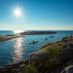 15 Best Family Kayak Trips In The World a family paddles in kayaks on a trip on Ontario's Georgian Bay