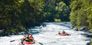 a group of rafters paddle down the renowned Hells Canyon section of the Klamath River