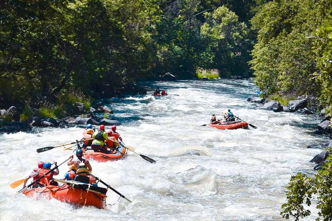 a group of rafters paddle down the renowned Hells Canyon section of the Klamath River