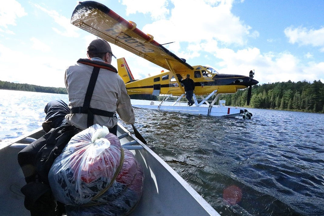 Park wardens fly out a sleeping bag filled with rotting garbage from Algonquin Park’s backcountry, left by campers who require remedial education