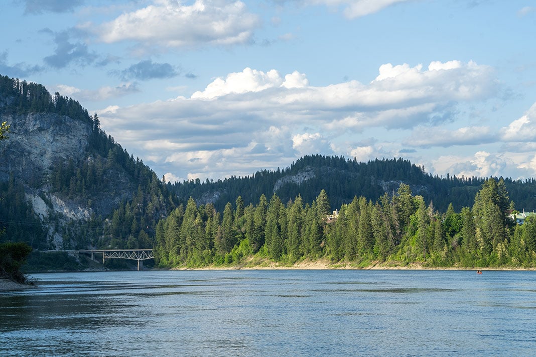 view of Columbia River and scenic surroundings with small red tandem canoe