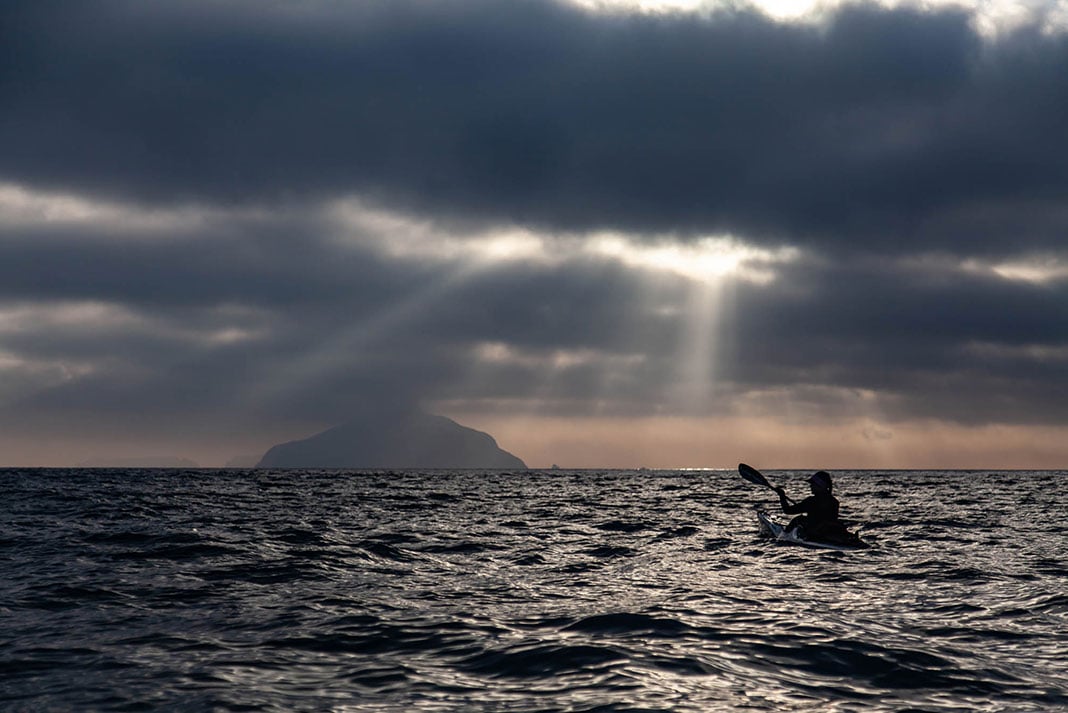 silhouetted view of Freya Hoffmeister on one of her greatest kayaking expeditions