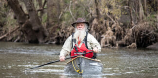 Dan Cooke photographed while paddling a canoe