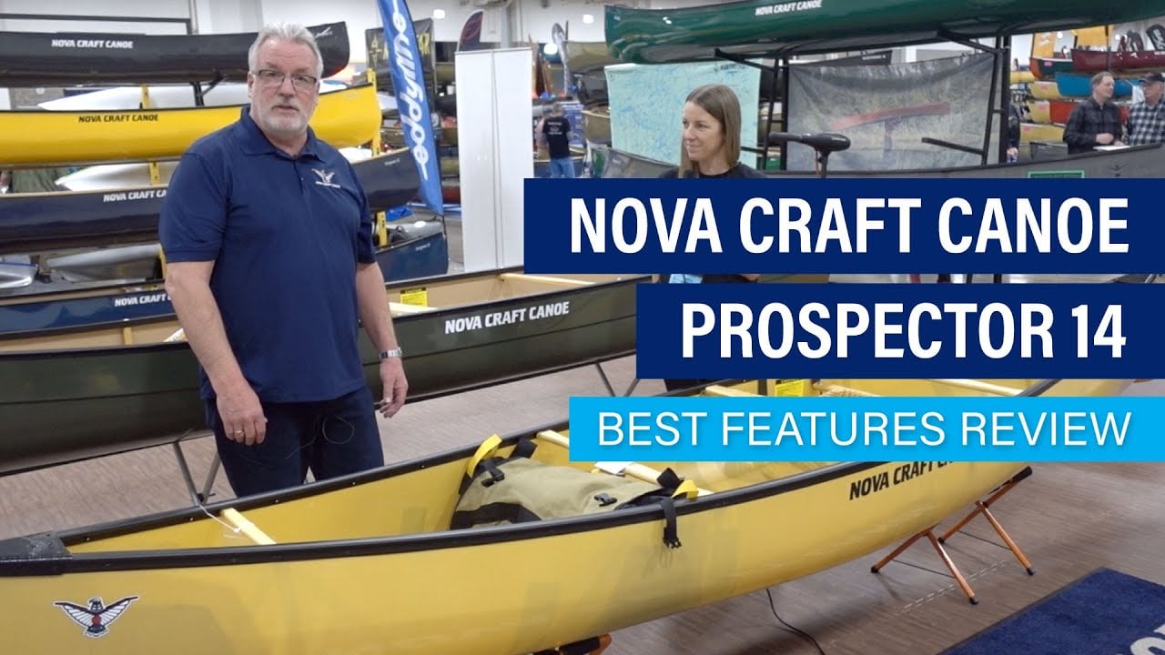 people stand beside the Nova Craft Prospector 14 at Canoecopia