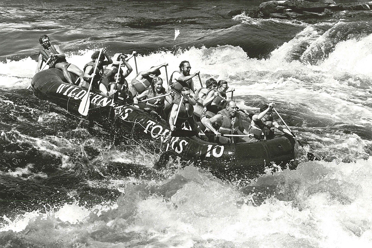 Wilderness Tours owner Joe Kowalski guides a raft with former Canadian prime minister Pierre Elliott Trudeau, circa 1981