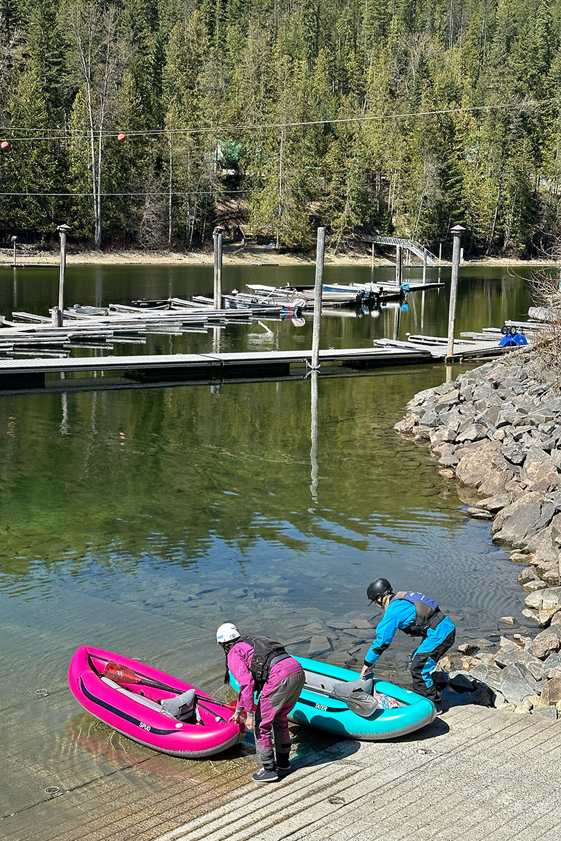 two paddlers launch their AIRE Tater and Spud boats