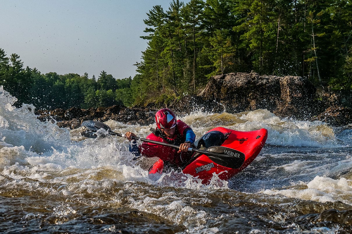 man paddling the Rockstar V whitewater kayak from Jackson Kayak