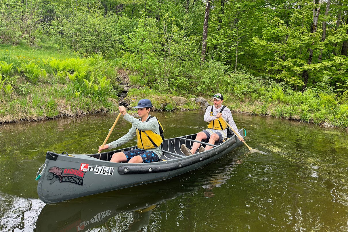 two people paddle the Radisson canoe by BW Marine Products