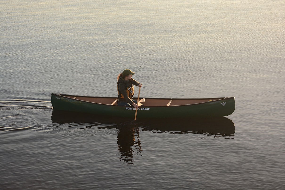 woman paddles the Nova Craft Canoe Prospector 14 solo canoe