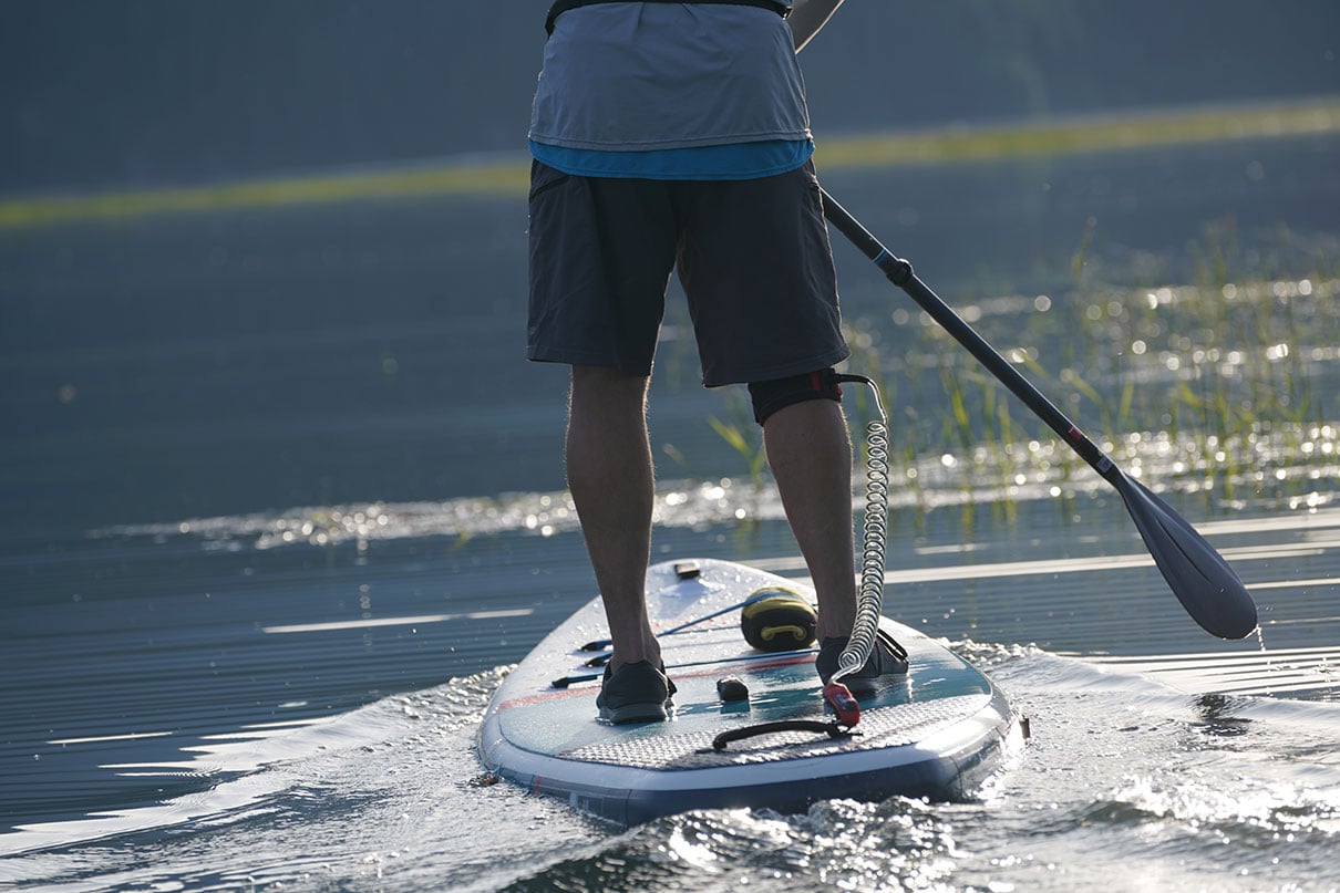 man paddles his paddleboard