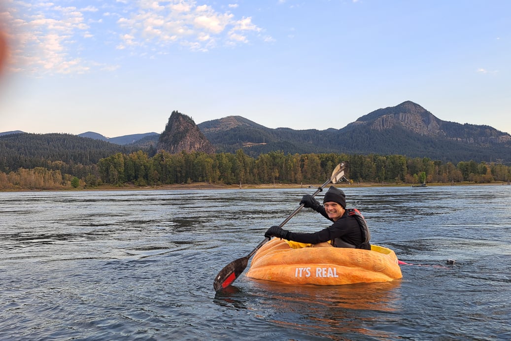 Gary Kristensen paddles his pumpkin boat on the Columbia River to set world record