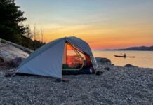 We believe finding the best Black Friday camping deals are a lot like finding this perfect campsite on a rocky beach lit by the sunset.