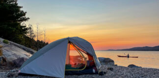 We believe finding the best Black Friday camping deals are a lot like finding this perfect campsite on a rocky beach lit by the sunset.