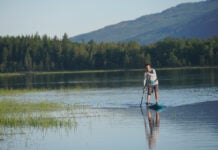 Paddleboard on lake.