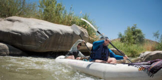 Paddling Magazine digital editor Joe Potoczak paddles an inflatable tandem kayak with a friend