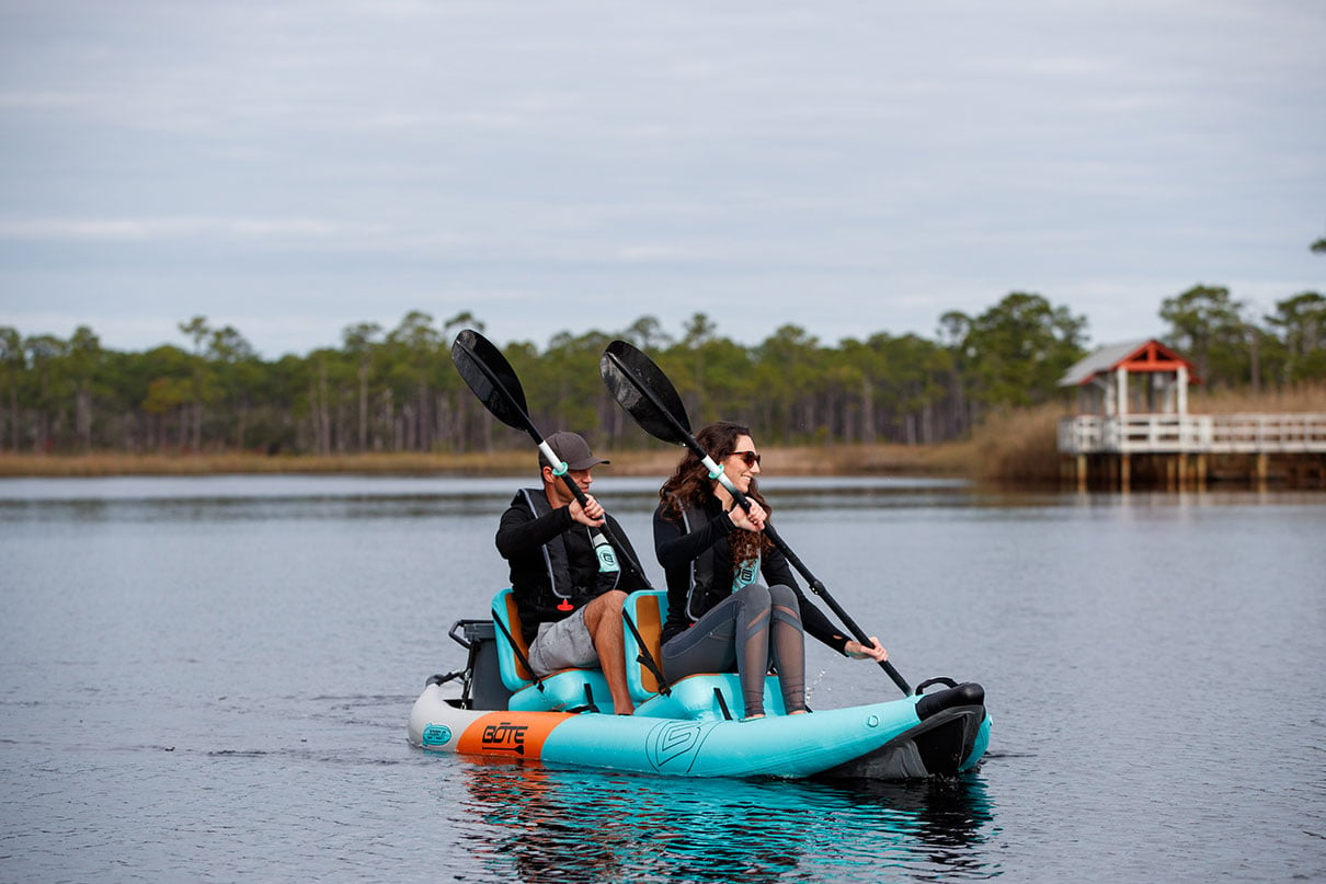 man and woman paddle The BOTE Zeppelin Aero 12'6" tandem inflatable hybrid SUP-kayak