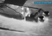 still from footage of rescue of teen kayaker offshore in Hawaii