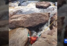 While rafting in Tasmania, Lithuanian man becomes trapped in a sieve. After 20 hours of rescue attempts, rescuers make the difficult decsion to amputate.