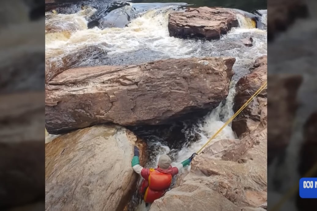 While rafting in Tasmania, Lithuanian man becomes trapped in a sieve. After 20 hours of rescue attempts, rescuers make the difficult decsion to amputate.