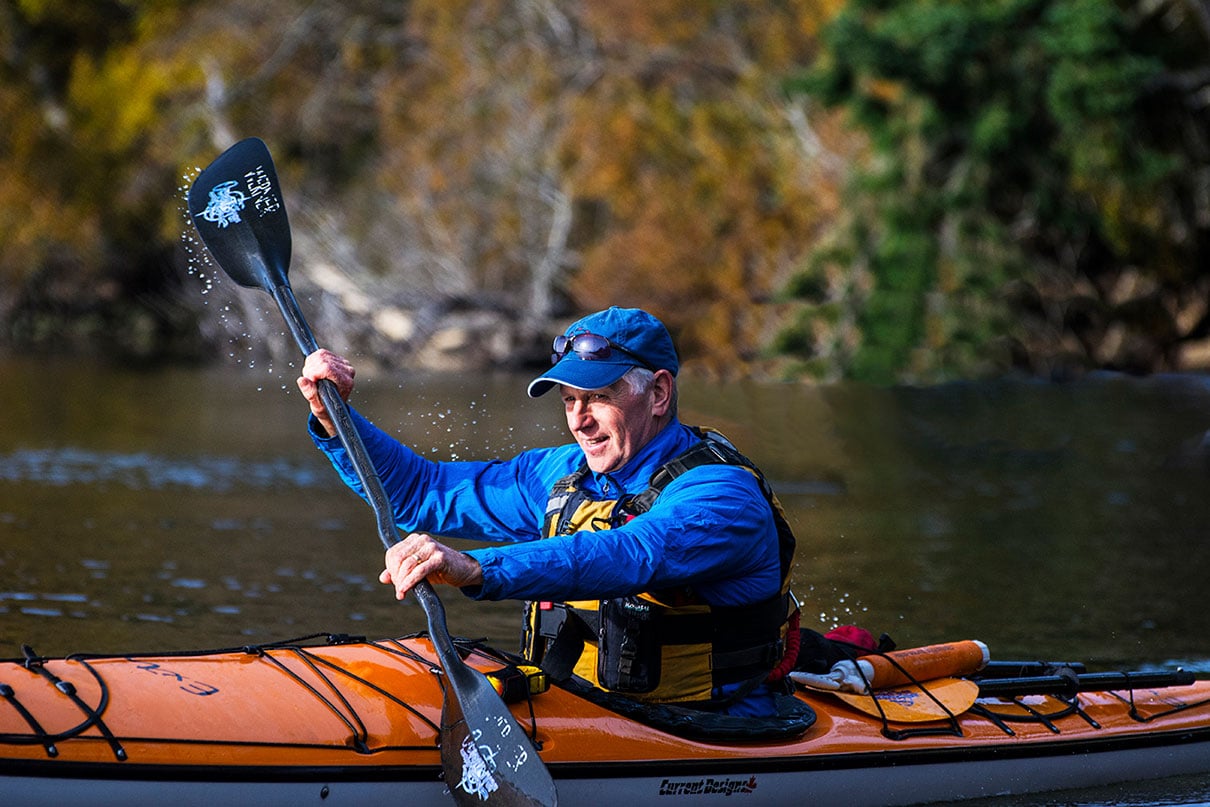 Brian Henry paddling a sit-in kayak