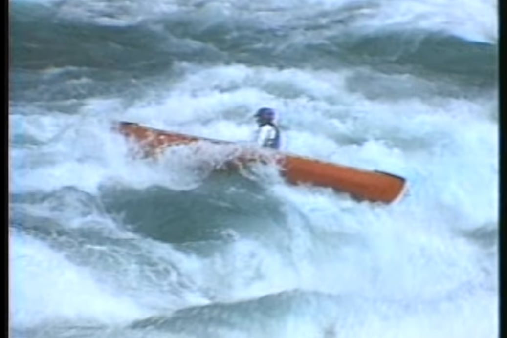 Image of Nolan Whitesell in an open canoe in the Niagara Gorge Rapids